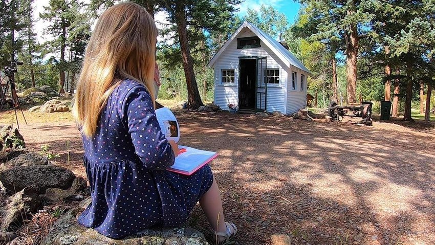A rundown abandoned cabin near Evergreen has been transformed into a community library.